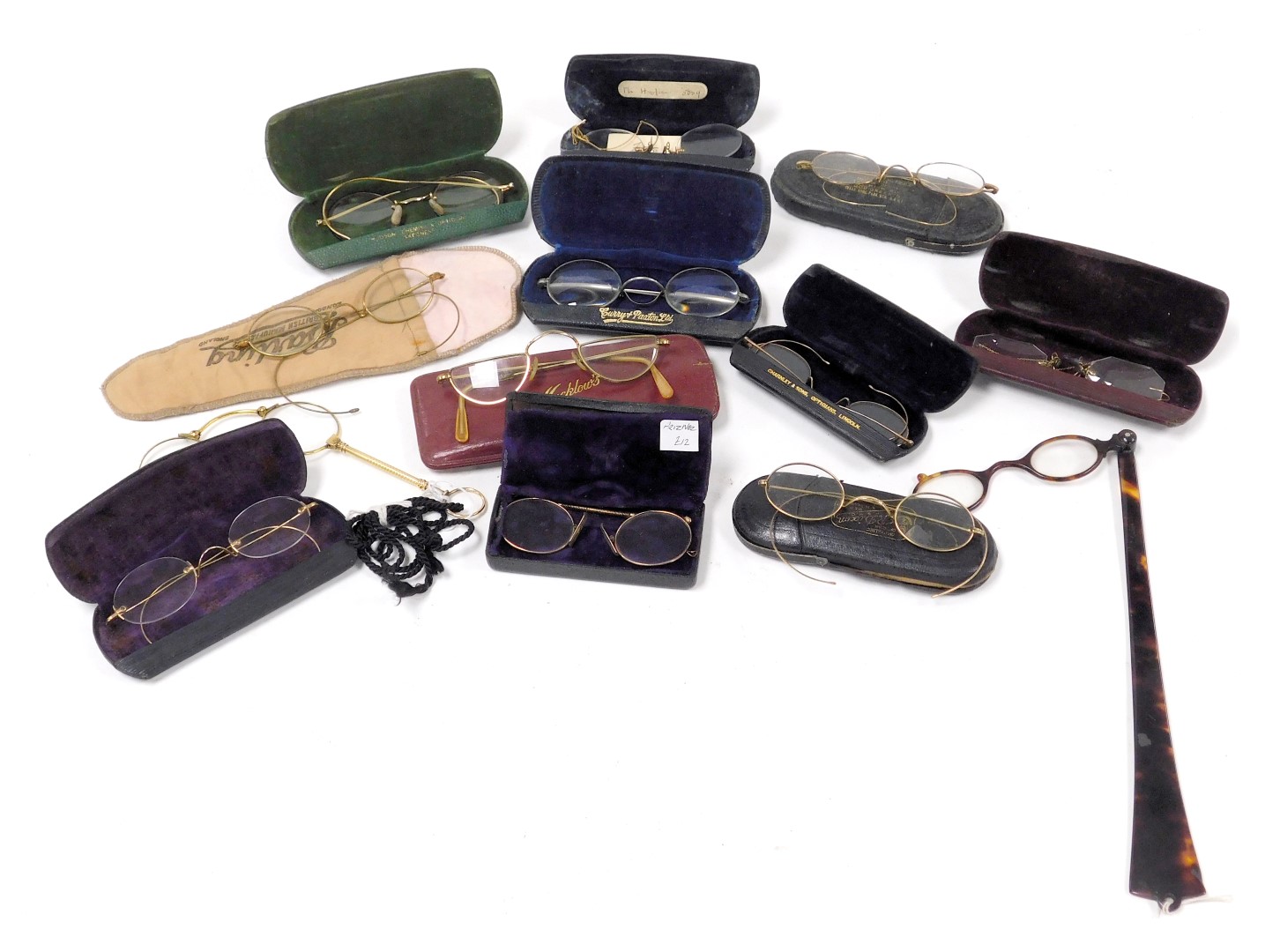 A group of early 20thC spectacles, some gold rimmed, cased, together with pince-nez, and lorgnettes.