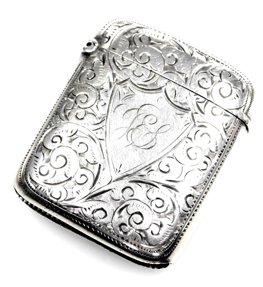 A Victorian silver vesta case, with engraved foliate decoration, monogrammed shield reserve, Birming