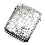 A Victorian silver vesta case, with engraved foliate decoration, monogrammed shield reserve, Birming