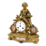 A late 19thC porcelain and gilt metal mantel clock, for R & G, Paris and London, circular enamel dia