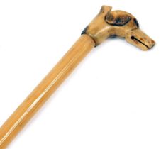 A bamboo and bone dog whistle stick, the whistle head carved as the head of a hound, 127cm high,