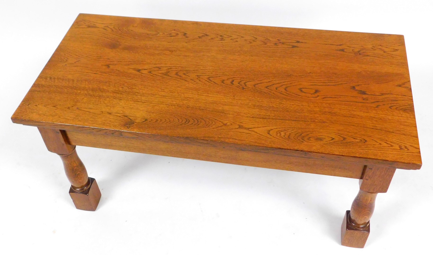 A rectangular oak coffee table, raised on turned and square block legs, 51cm high, 107cm wide, 50.5c - Image 3 of 4