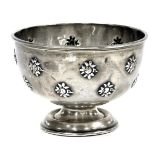 An Edward VII silver sugar bowl, with repousse repeating flower heads, Birmingham 1905, 1.97oz.