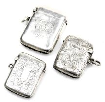 Three early 20thC silver vesta cases, one of plain form, monogram engraved and dated 1912, the other