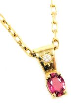 A garnet and cz pendant, in yellow metal, stamped 18c, on a 9ct gold cable link neckchain, on a bolt