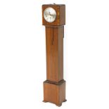 An early 20thC walnut cased grandmother clock, circular silvered dial bearing Arabic numerals, eight