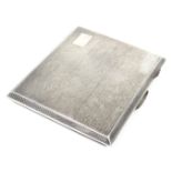 A George V silver cigarette case, with engine turned decoration, vacant rectangular reserve, Birming