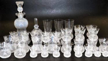 An Edinburgh Crystal Thistle Pattern suite of table glassware, including champagne flutes, red and w