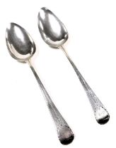 A pair of George III silver tablespoons, with bright cut engraving, terminal with monogram reserve,