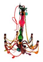 A mid-century Murano style six branch chandelier, with a varicoloured stem and chain links, 61cm hig