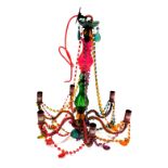 A mid-century Murano style six branch chandelier, with a varicoloured stem and chain links, 61cm hig
