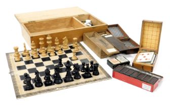 A Staunton type chess set, and draughts, boxed with a board, together with two cribbage boards, a bo