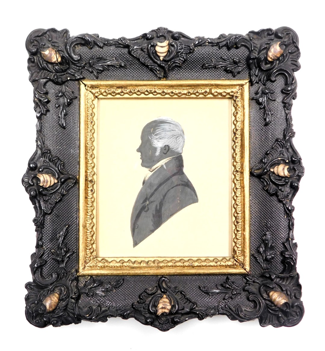 An early 19thC silhouette portrait, study of a gentleman, in a stylised frame, 9.5cm x 8cm.