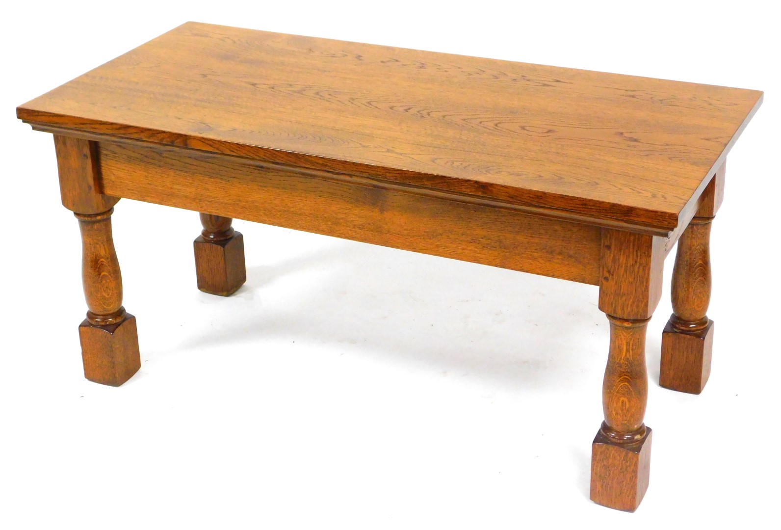 A rectangular oak coffee table, raised on turned and square block legs, 51cm high, 107cm wide, 50.5c - Image 2 of 4