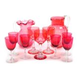 A set of six early 20thC cranberry wine glasses, three flashed wine glasses, and two cranberry glass