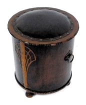 An Art Deco bi-colour oak coal bucket, of cylindrical form, with a studded leather seat, and copper