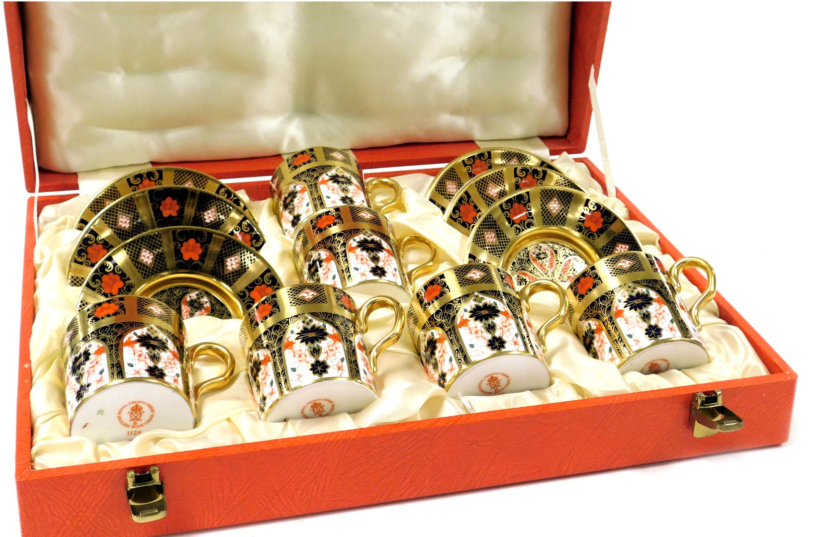 A Royal Crown Derby Imari porcelain gold ground coffee set, pattern no. 1128, comprising six coffee