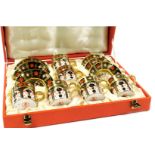 A Royal Crown Derby Imari porcelain gold ground coffee set, pattern no. 1128, comprising six coffee