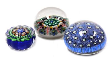 A Vasart millefiori glass paperweight, of seven spoke form, 6cm wide, Murano millefiori glass paperw