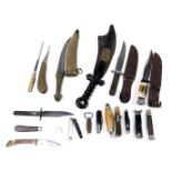A group of folding pocket knives, together with hunting knives, Middle Eastern dagger, and a Victori