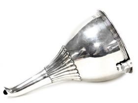 A George III silver wine funnel, of semi fluted form, crest engraved, London 1799, 3.46oz.