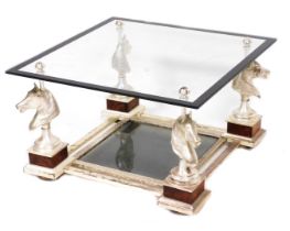 A French Maison Charles silvered cast iron coffee table, circa 1970s, with a square glass top, raise