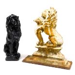 A Victorian cast iron door stop, modelled as a rampant lion, raised on a plinth above a rectangular