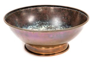 A 19thC copper bowl, possibly for containing Catholic holy water, with an embossed medallion to the