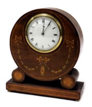 An Edwardian mahogany and inlaid mantel clock, circular enamel dial bearing Roman numerals, eight da