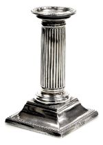 A Victorian silver Doric column candlestick, with detachable sconce, having beaded borders and squar