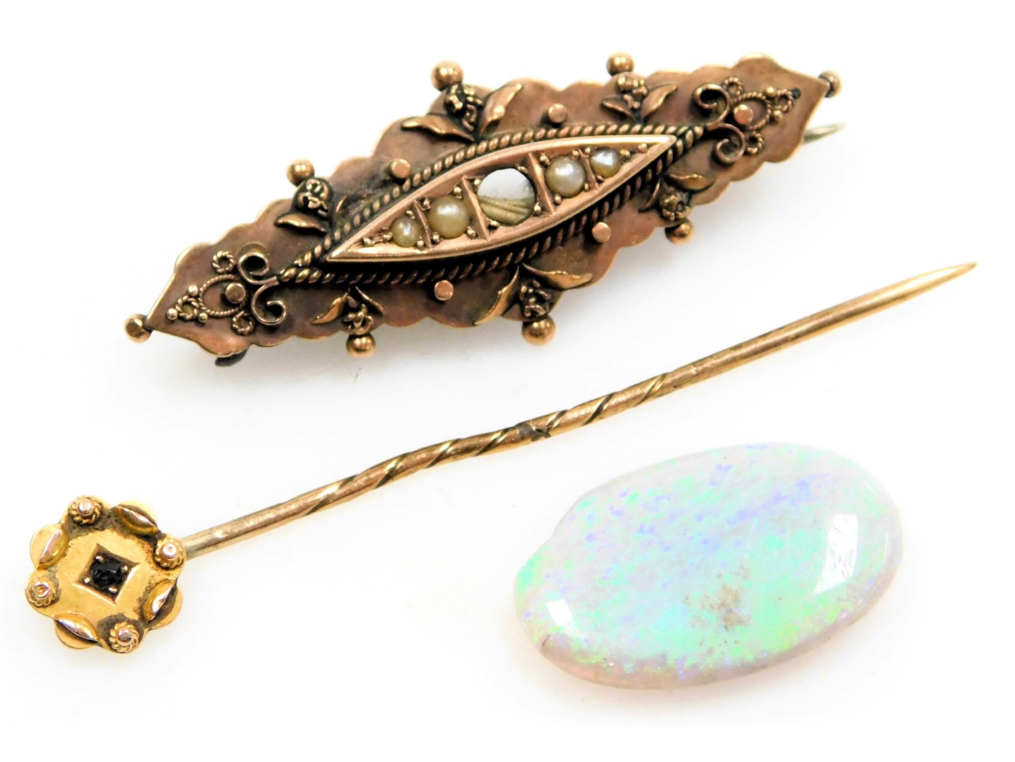 A Victorian 9ct gold and seed pearl set brooch, central stone lacking, 9ct gold and sapphire tie pin