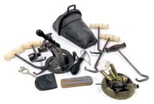 A vintage shotgun crimping tool, an 18thC postillion boot, five bone and wooden handled boot pulls,