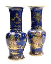 A pair of Carltonware chinoiserie lustre vases, decorated with pagodas and figures in a landscape, n