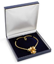 A Grosse gold plated and simulated pearl floral pendant on chain, dated 1963.