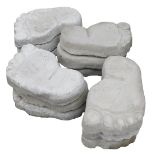 Twelve concrete stepping stones, modelled as feet, 26.5cm wide.