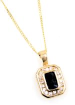 A 9ct gold sapphire and diamond pendant, in an octagonal mount, on a fine neckchain, with bolt ring