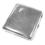 A George V silver cigarette case, with engine turned decoration, circular reserve monogram engraved,