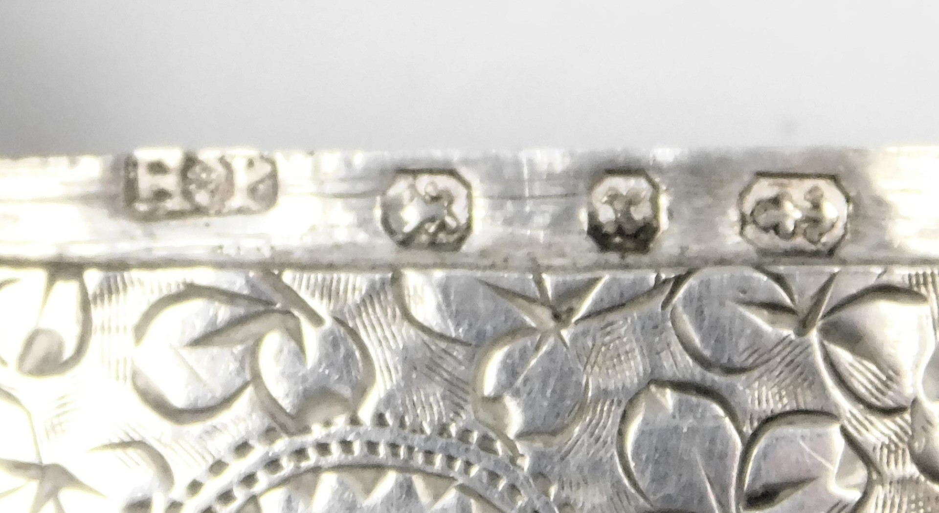 Three silver vesta cases, one of plain form, two with floral and foliate engraving, 1.85oz. - Image 3 of 3