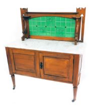 A Victorian satin walnut washstand, with a tiled splashback and white metal top over a pair of panel