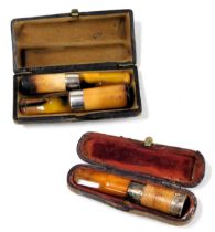 A meerschaum cigar holder, and a cheroot holder, with silver banding and amber tips, cased, and a fu
