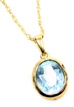 A 9ct gold and aquamarine pendant, in an oval setting, on a fine neckchain, with a bolt ring clasp,
