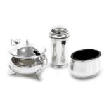 A composite silver three piece condiment set, with blue glass liners, comprising pepperette, oval sa