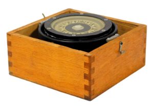 A mid-century ship's gimbal compass, oak cased, compass 13cm wide.