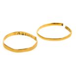 Two 22ct gold wedding bands, one cut, size O, 1.7g.