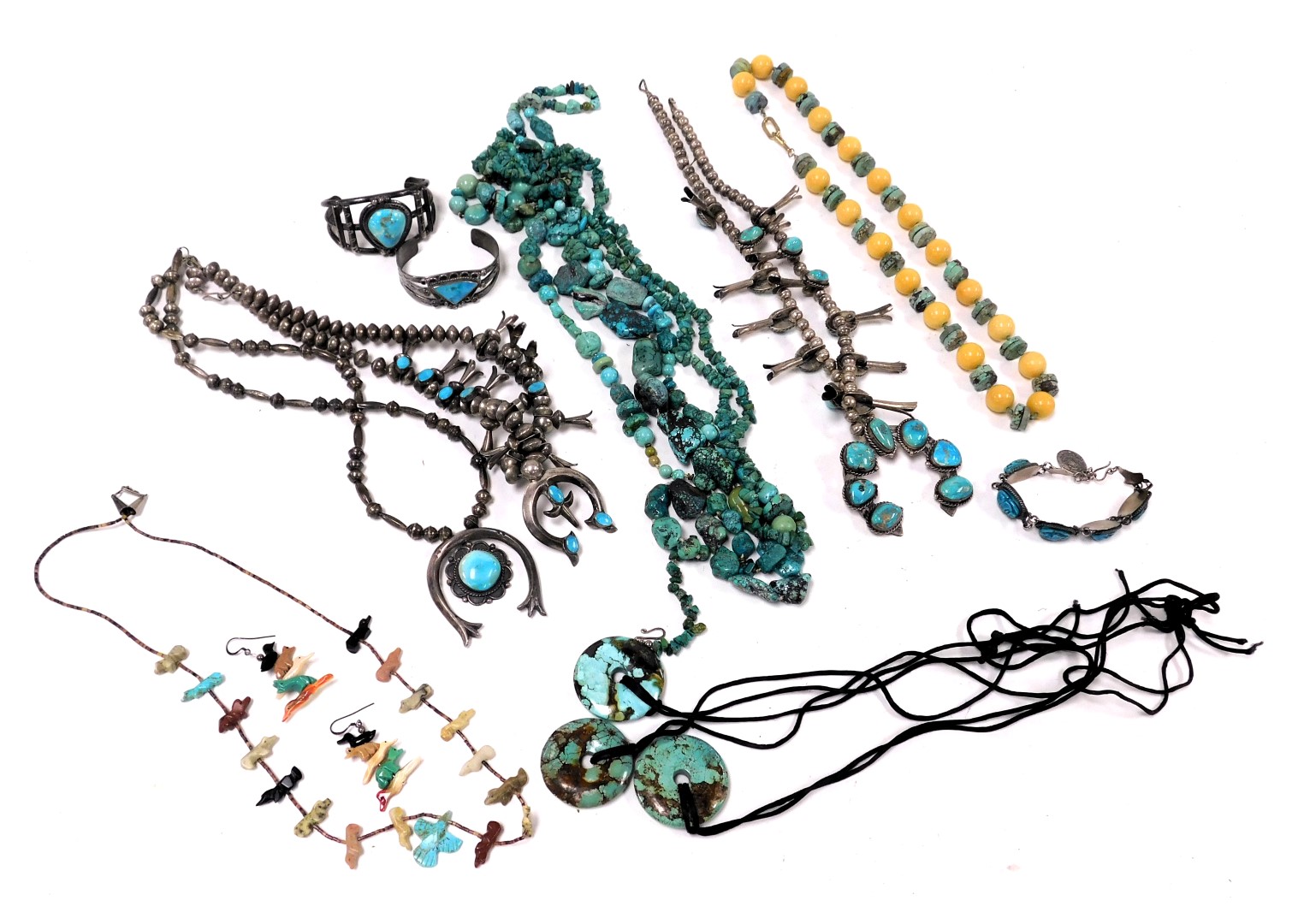 A group of Navajo and other turquoise set jewellery, including necklaces, bangles and pendants. (a q