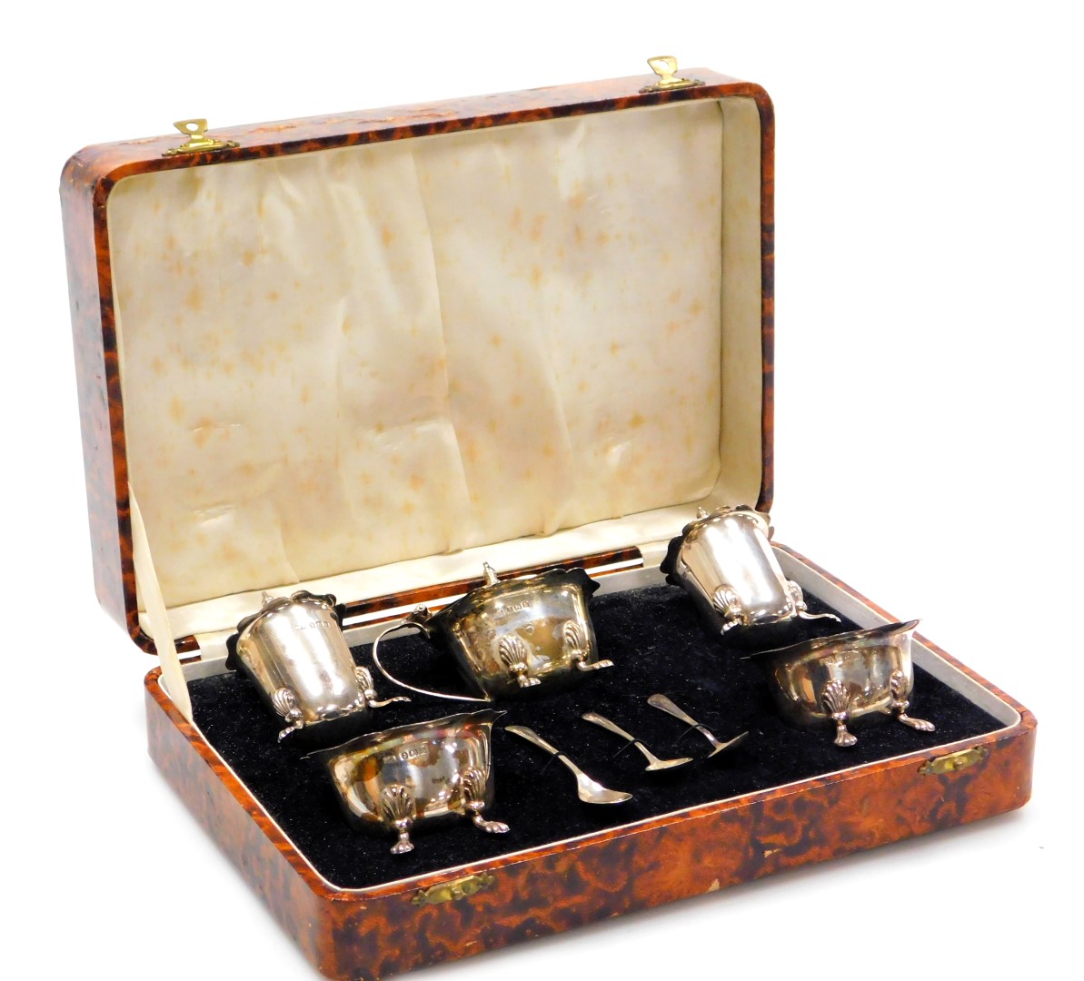 A George V silver five piece cruet set, comprising a pair of pepper pots, pair of salts, and a musta