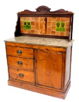 A Victorian Lincolnshire pine dresser, with a tiled splash back decorated with a standing lady, and