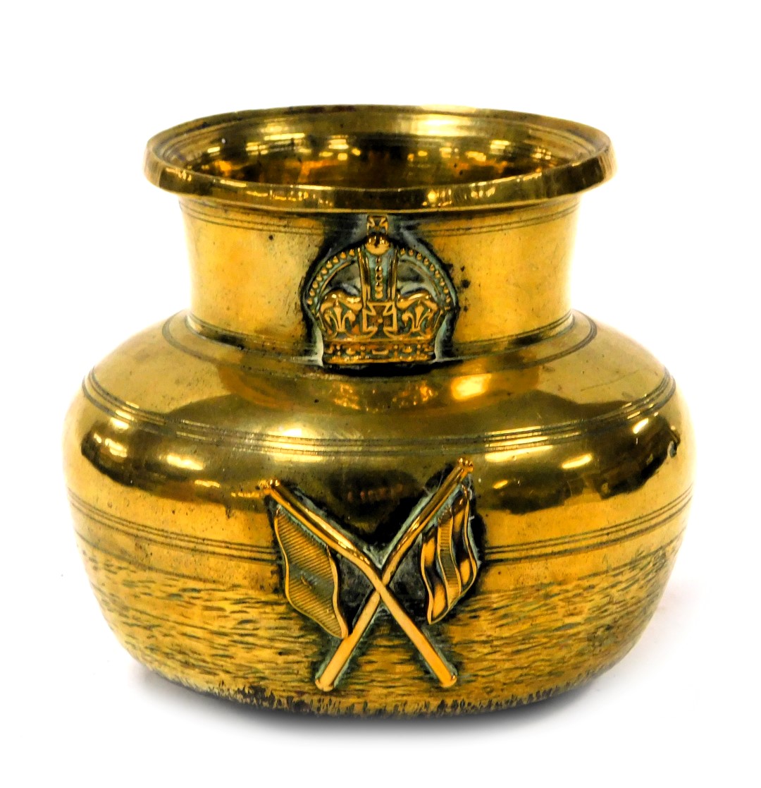 A Victorian brass vessel, possibly a spitoon, embossed with a crown above a pair of crossed flags, 1