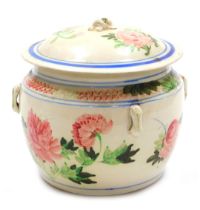 A late 19thC French pottery pot and cover, hand painted with flowers, 23cm wide.
