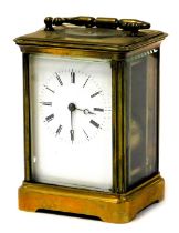 A late 19thC French brass cased carriage clock, rectangular enamel dial bearing Roman numerals, sing
